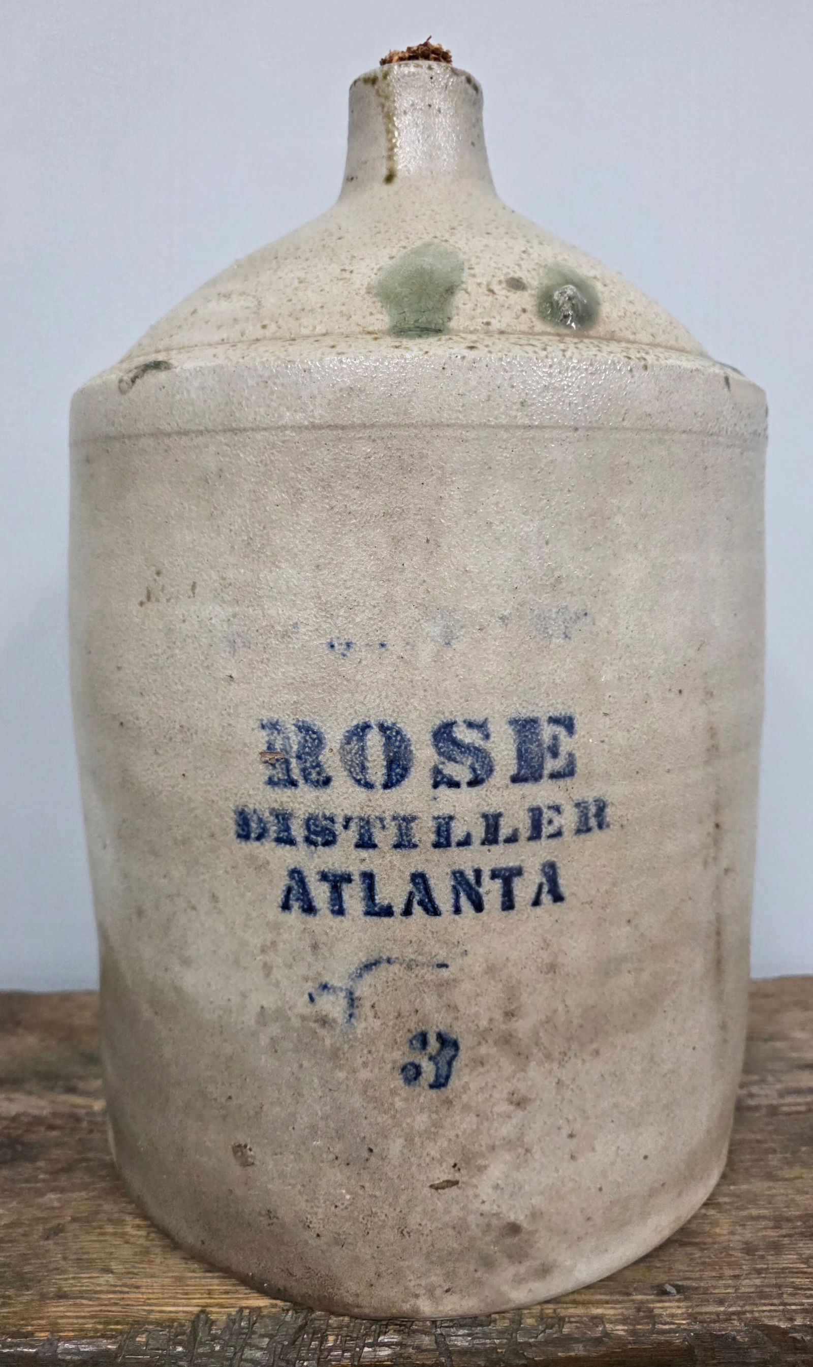 Early 3 Gal Rose Distillers Atlanta Jug: Early R.M. Rose 3 Gallon Rose Distillers Atlanta Jug. salt glaze body with Strong cobalt blue stencil. Outstanding eye appeal with early green kiln drips and orange peel salt glaze. This is a Cagle to