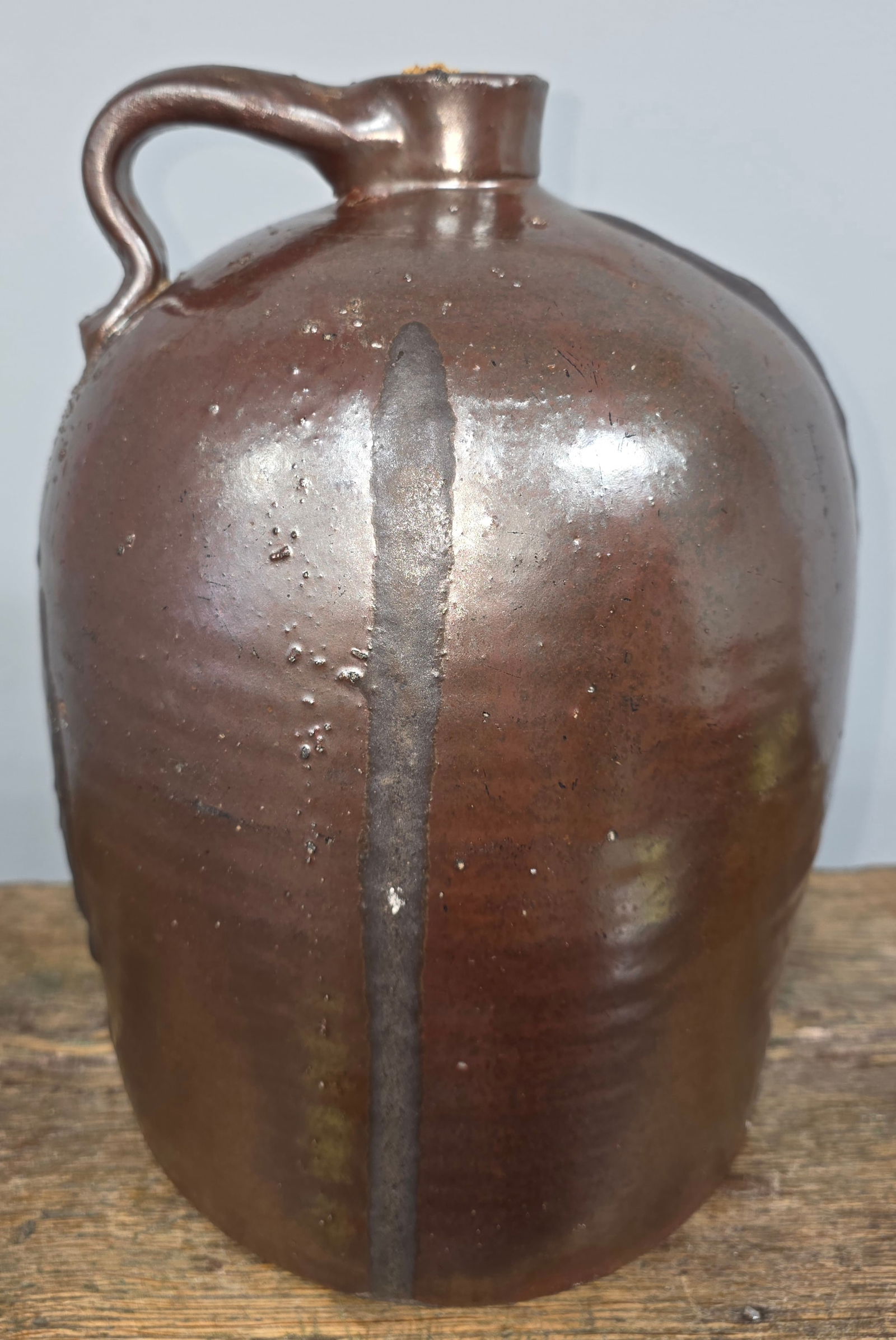 Signed J W Franklin Marietta, Ga 2 Gal Jug: Signed J W Franklin Marietta, Ga 2 Gal Jug in a rich mature slip glaze and two large melted glaze runs/ kiln drips that cascade down the jug. This is an extremely scare example that is in collector gr