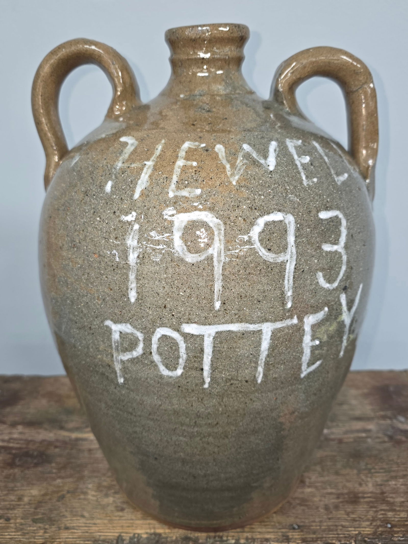 1993 Hewell Pottery Jug By Chester Hewell: 1993 Hewell Pottery Jug By Chester Hewell note the misspelling in "pottey". Collector grade condition, no damage or repairs. Standing: 14 1/8" Tall