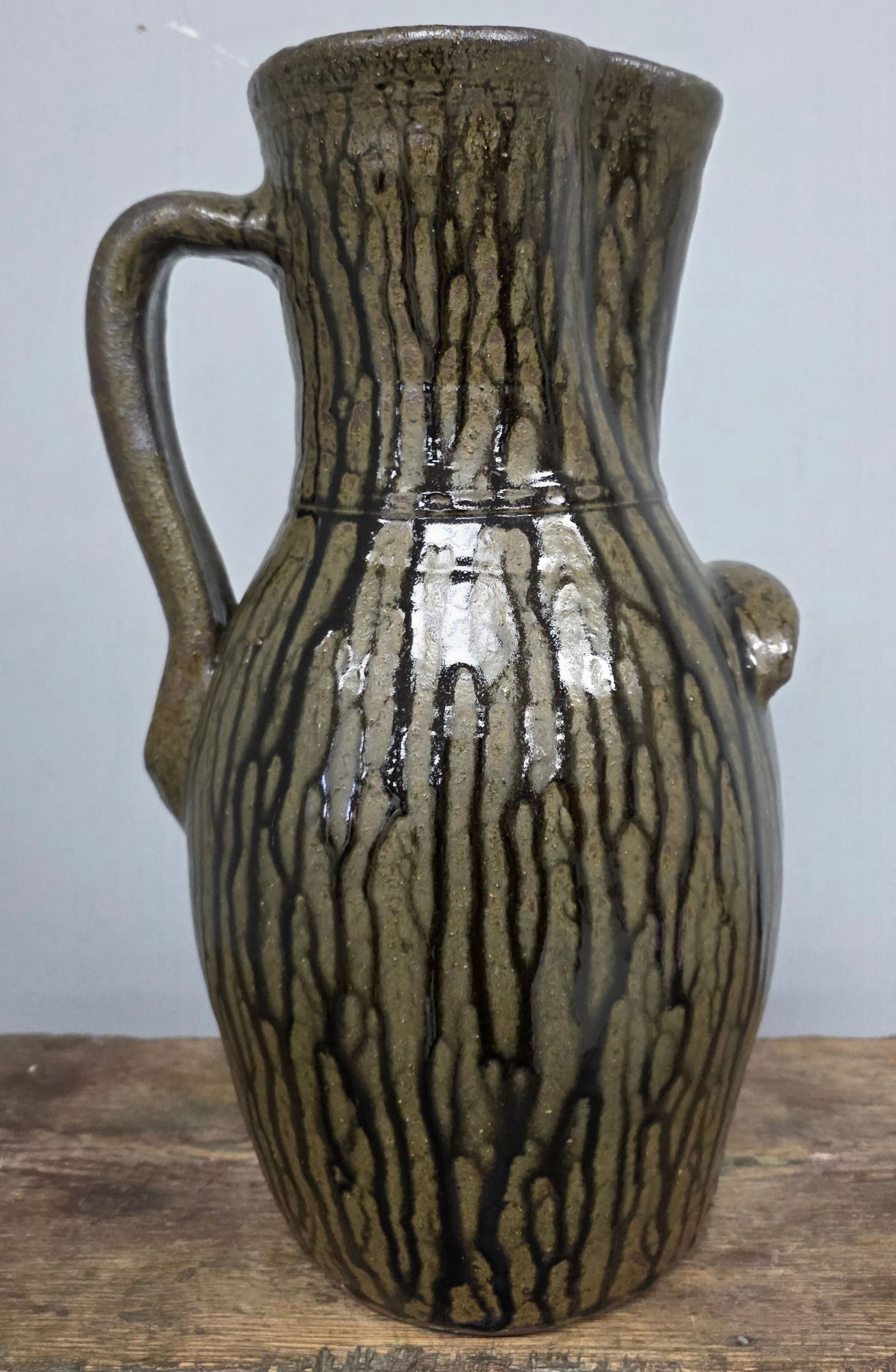 Large Harold Hewell Signed "HH" Pitcher: Large Harold Hewell Signed "HH" Pitcher that has a stellar runny alkaline glaze. Stamped on the handle. No damage or repairs. These are really impressive when displayed. Standing: 17 1/8" Tall