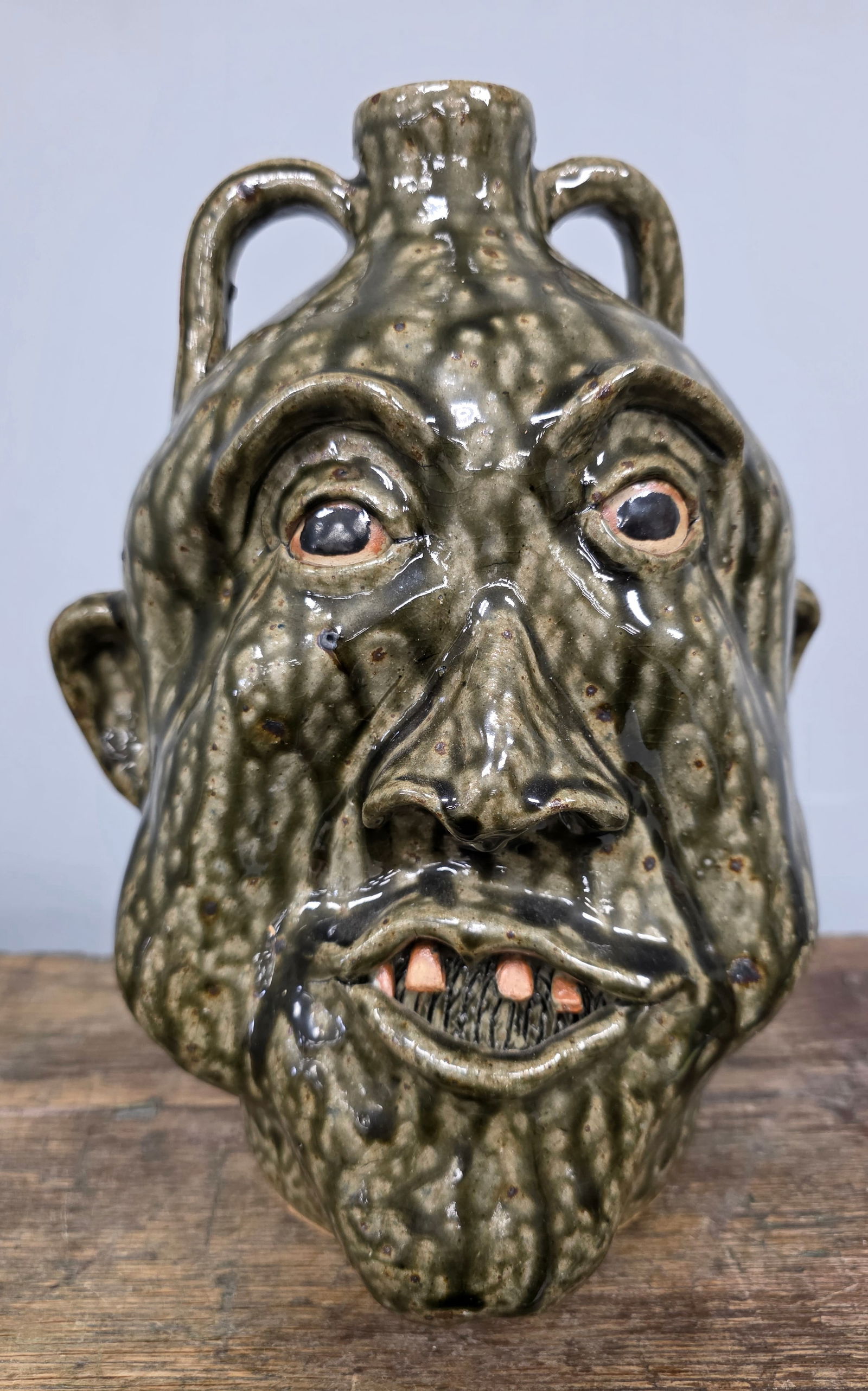 1992 Cleter Meaders Jr. Folk Pottery Face Jug: 1992 Cleter Meaders Jr. Folk Pottery Face Jug "Grover" with great eye appeal and folky facial features. Collector grade no damage or repairs. Standing: 10 3/8" Tall