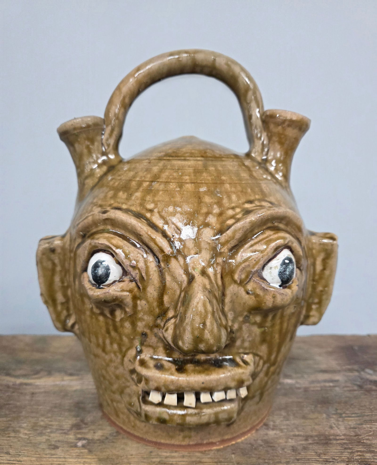 Fine Early Period Marvin Bailey Face Harvest Jug: Fine Early Period Marvin Bailey Face Harvest Jug with China plate teeth in folky facial features. This jug is in collector grade condition with no damage or repairs. Standing: 11 5/8" Tall