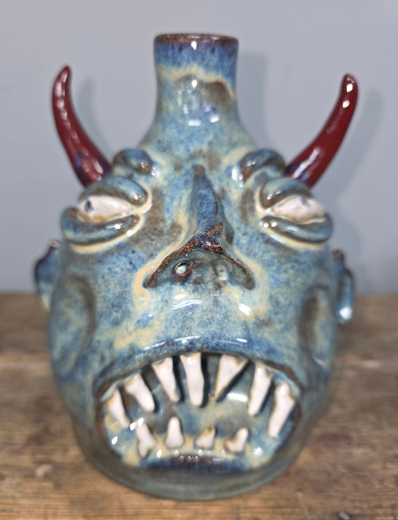 Jackie Apessos Devil Folk Pottery Face Jug: (Blue Colored) 2021 Jackie Apessos Devil Folk Pottery Face Jug in collector grade condition. Highly sought after folk potter. Outstanding Folky details with great eye appeal. Standing: