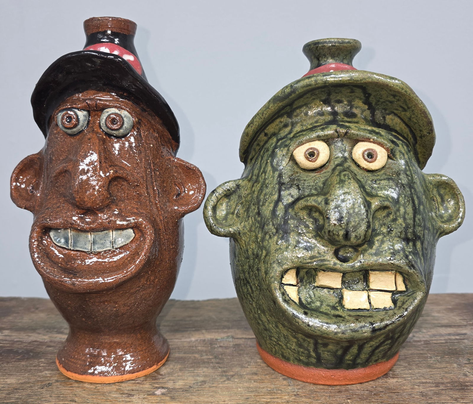 Brian Wilson Folk Pottery Face Jug Lot: Brian Wilson Folk Pottery Face Jug Lot in collector grade condition, no damage. Standing: 8 1/4 & 8 5/8" Tall
