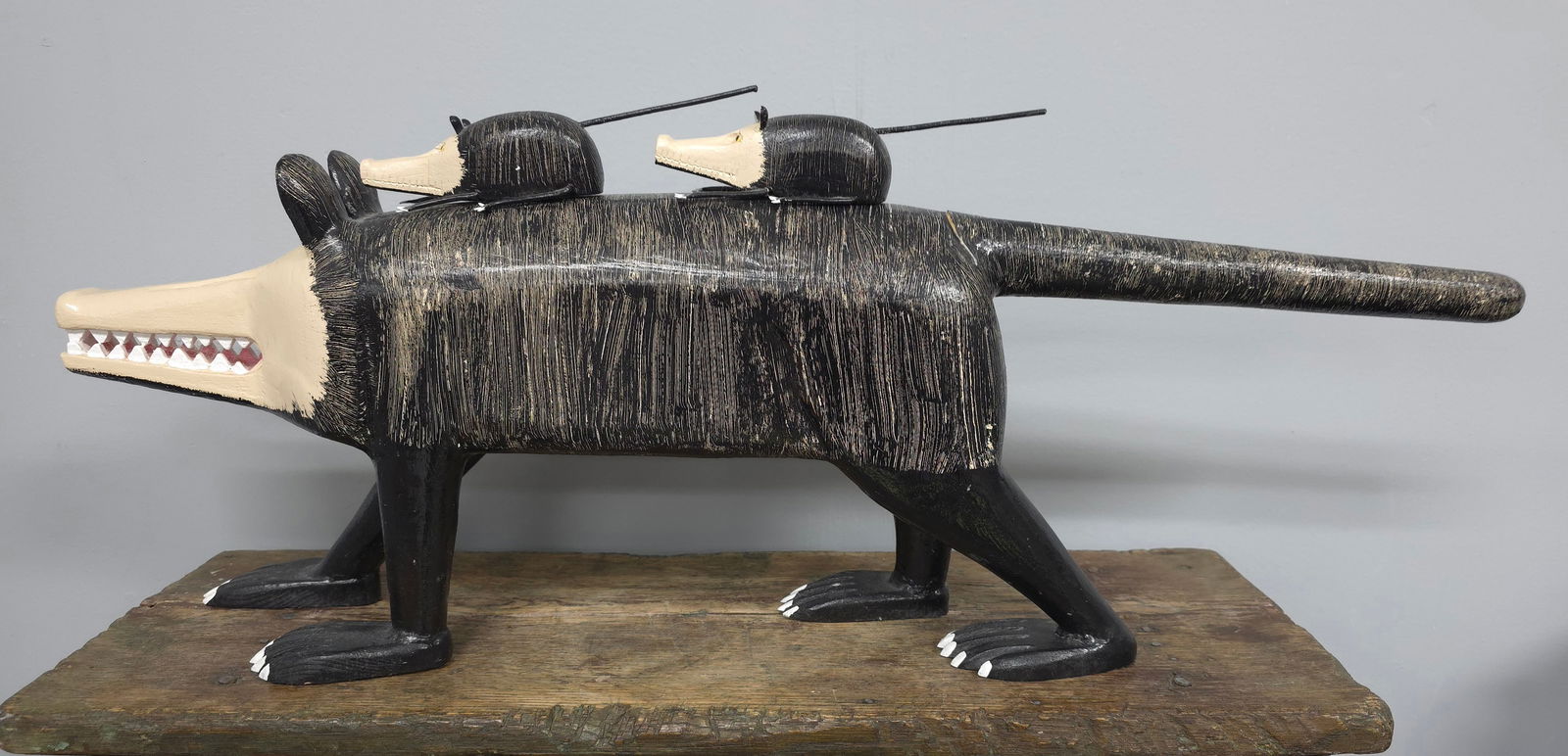 Twyla and Lonnie Money's Folk Art Carved Opossum: Fantastic Twyla and Lonnie Money's Folk Art Carved Opossum with two little ones that sit on top with a magnet strip. Collector grade condition. Signed on foot. Size: 28" L x 9 1/2" T