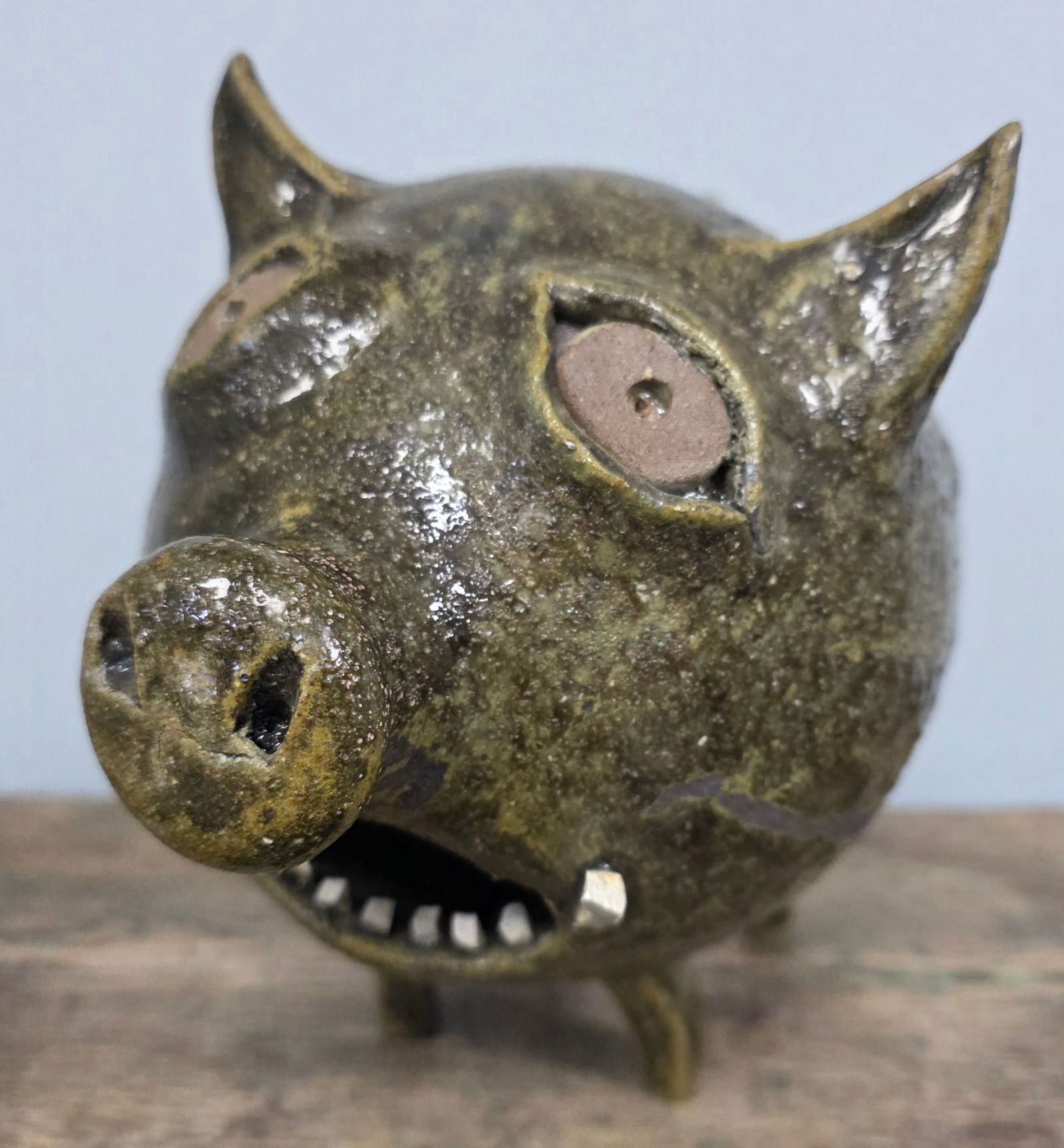 Daddy Hewell #2 Folk Pottery Boar: Daddy Hewell #2 Folk Pottery Boar with china plate teeth. In collector grade condition with no damage. Standing 7 5/8" tall x 8" wide.