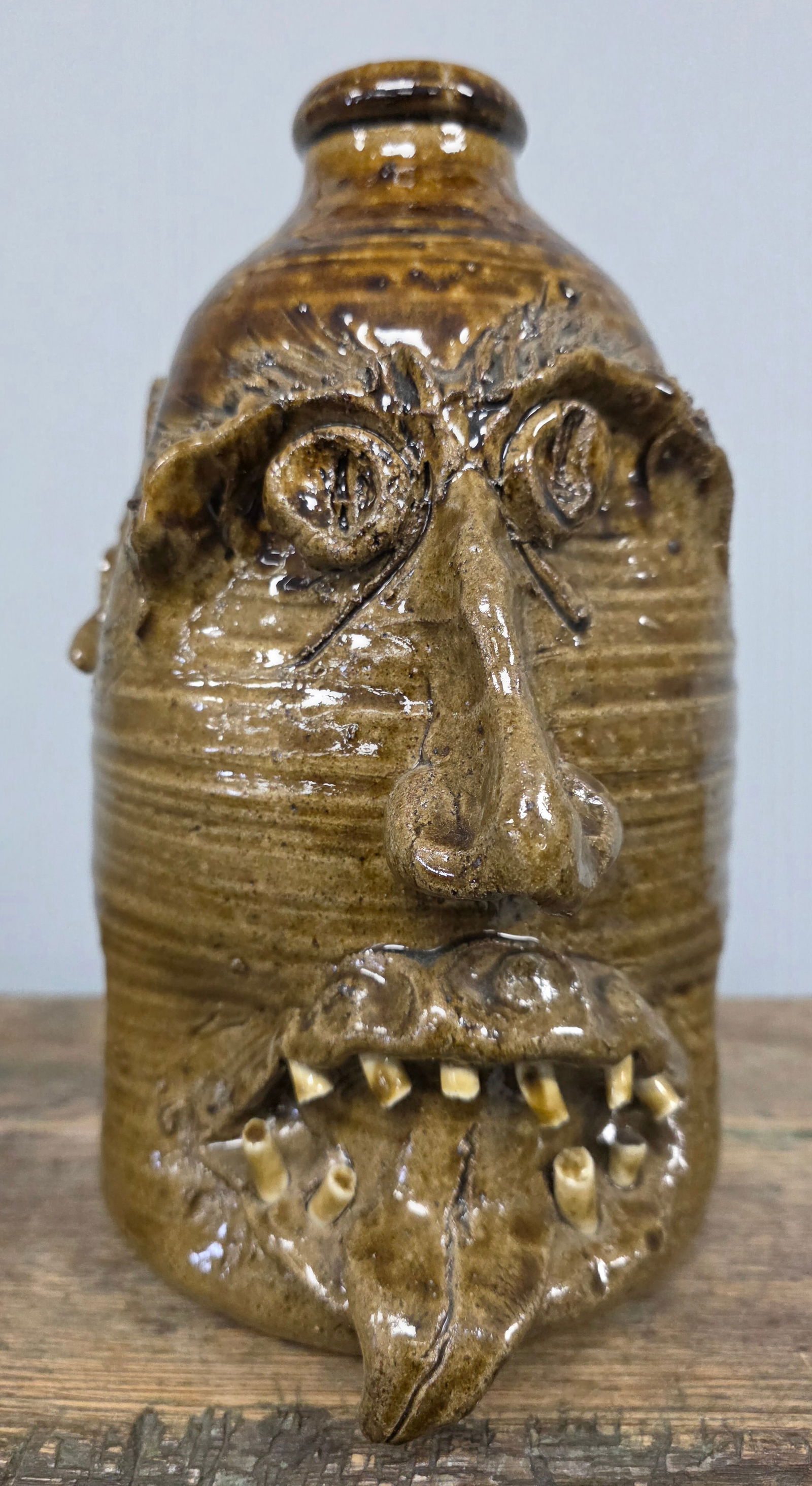 1990 W.T. McLennan of Holly Tree, Alabama Face Jug: 1990 William Todd McLennan Face Jug. Signed W.T. McLennan, Holly Tree, Alabama. In collector grade condition with no damage. Standing 10" tall.