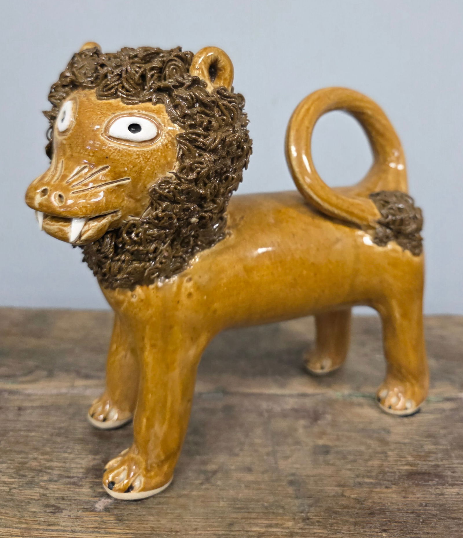 2005 Moore Pottery Folk Pottery Lion: 2005 Moore Pottery Folk Pottery Lion. Signed and dated in collector grade condition with no damage. Standing 7 3/8" tall x 8" wide.