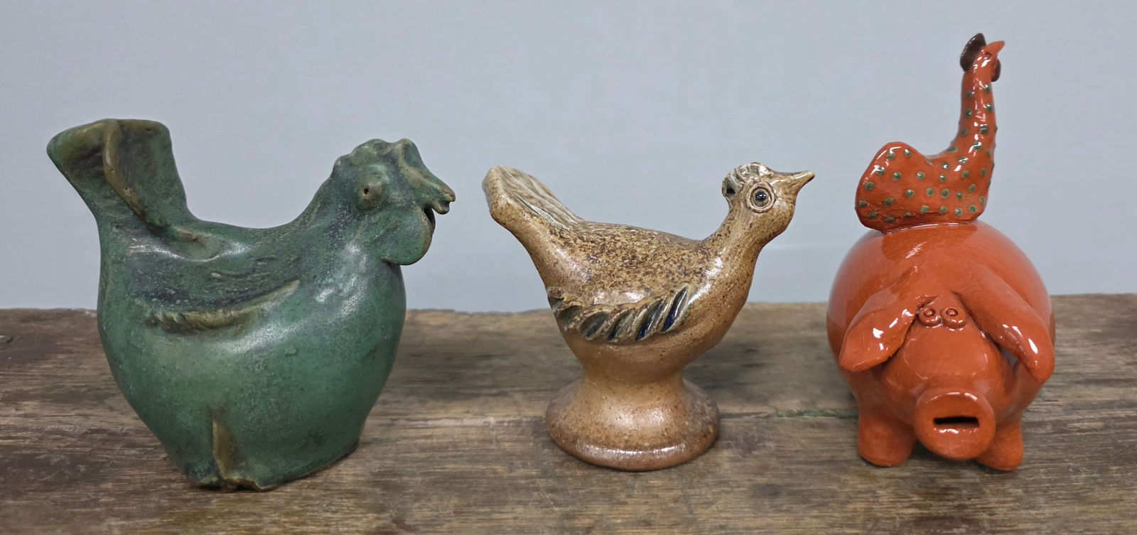 Seagrove, NC Folk Art Pig & Rooster Lot of 3: Seagrove, North Carolina Folk Art Pig & Rooster Lot of 3. One is signed Jugtown 2001 by Pamela Owens, another is stamped but it's not legible. Tallest one Standing 4 3/4" tall.