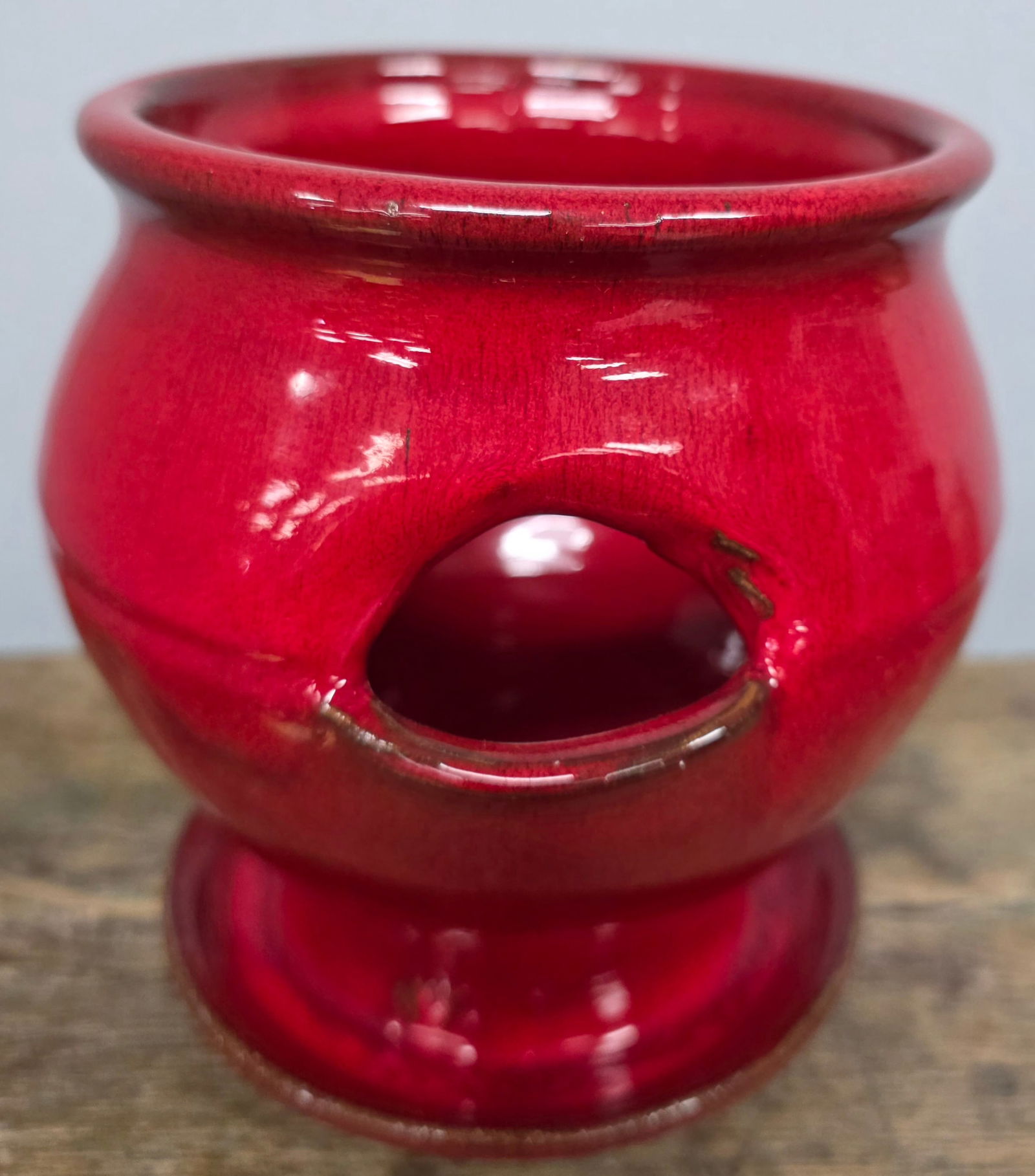 ML Owens NC Red Glaze Strawberry Pot: ML Owens, Seagrove, North Carolina, Red Glaze Strawberry Pot. Circa 2000, standing 6 1/2" tall.