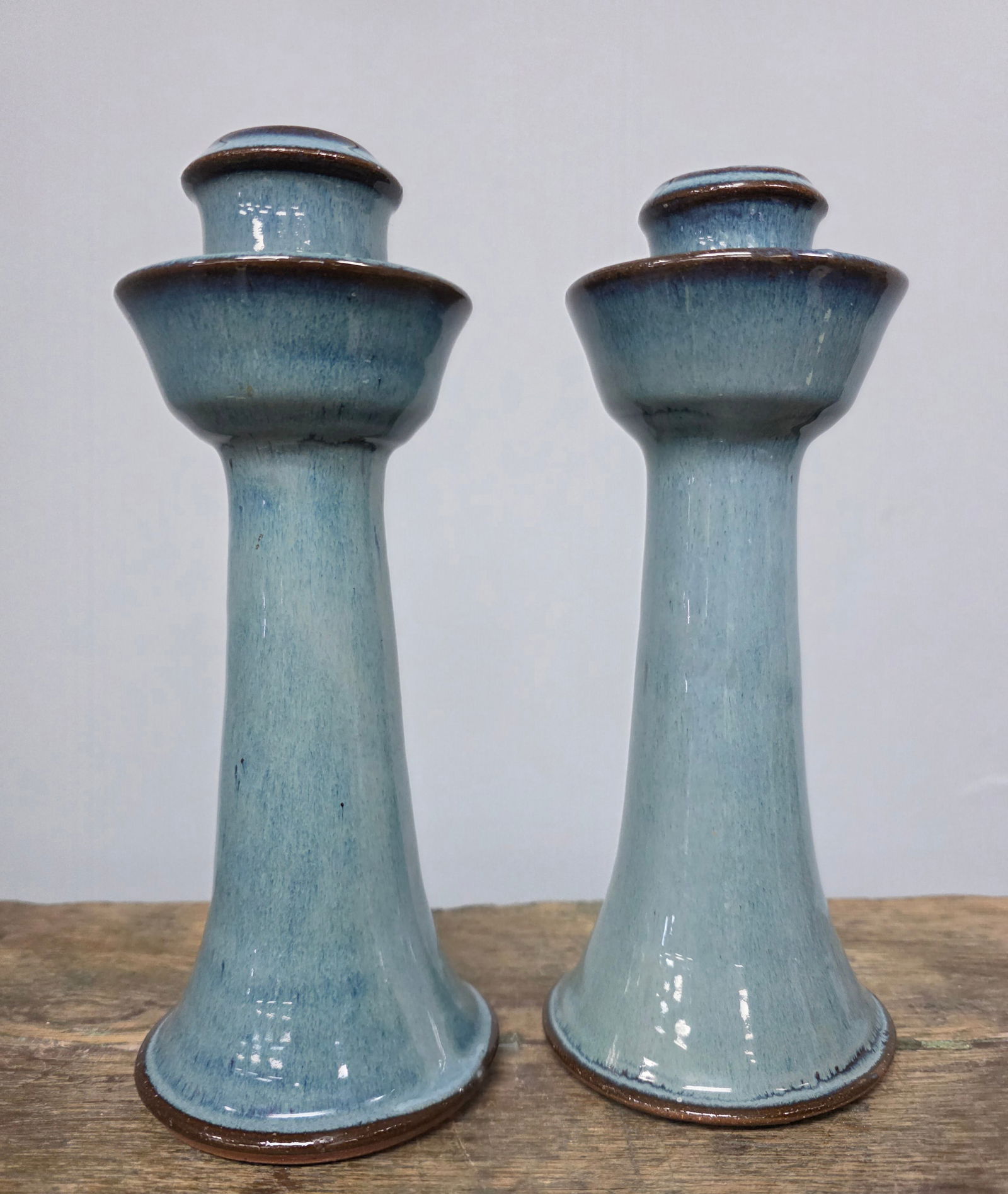 M.L. Owens Blue Glaze Candlesticks: M.L. Owens Blue Glaze Candlesticks (2). Standing 8 1/2" tall.