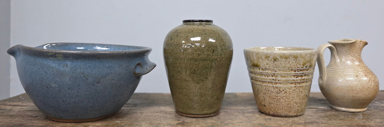 Jugtown Pottery Lot of 4: Jugtown Pottery Lot of Four. all are signed and in collector grade condition with no damage. 1- Vernon Owens 2005 small batter bowl/pitcher. Standing 3 1/4" tall x 7" wide. 2- Decorated 2005 SAlt