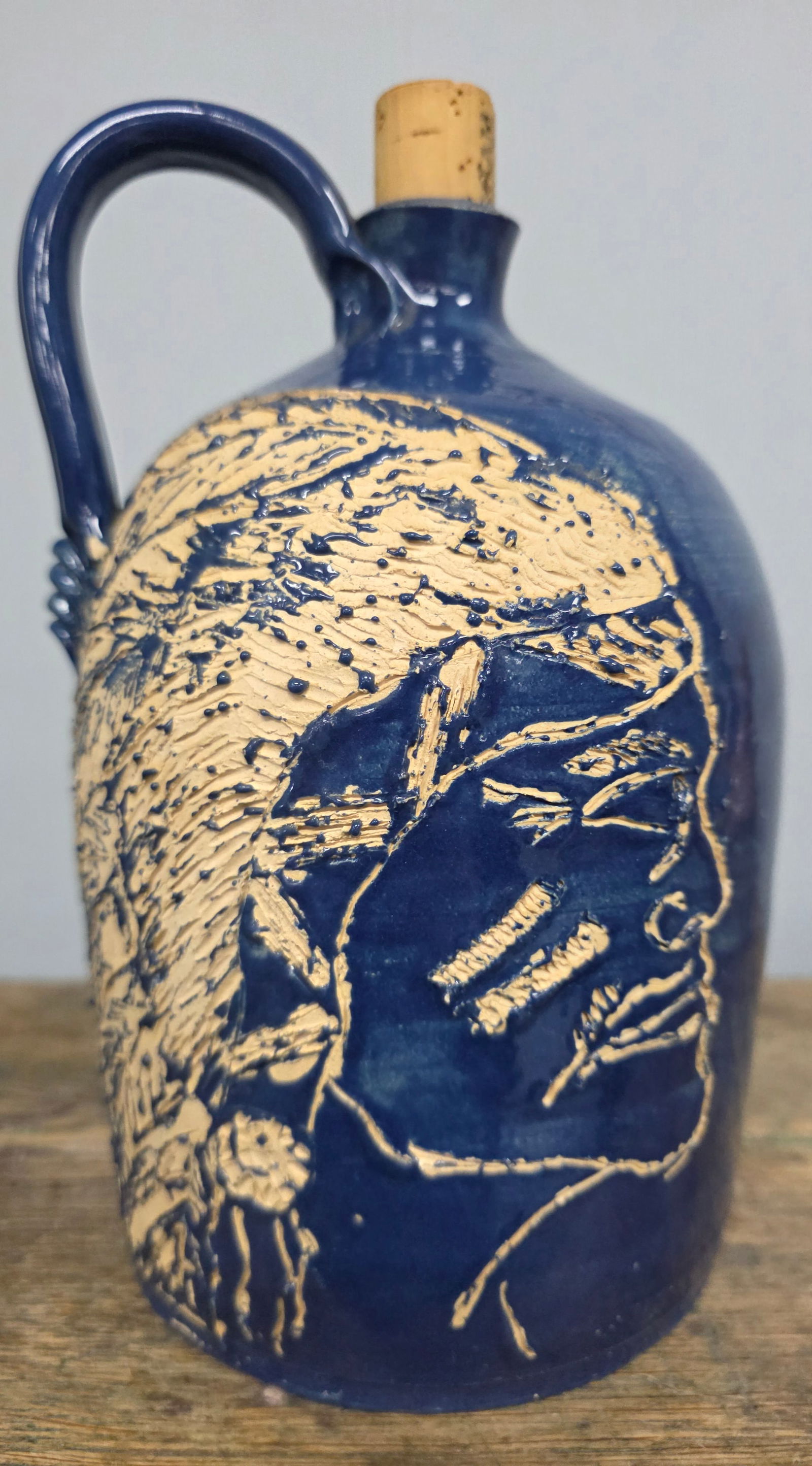 2005 Brad Abernathy Native American Jug: 2005 Brad Abernathy Blue Native American Indian Chief Scratch Decorated Face Jug. Standing 8 34" tall.