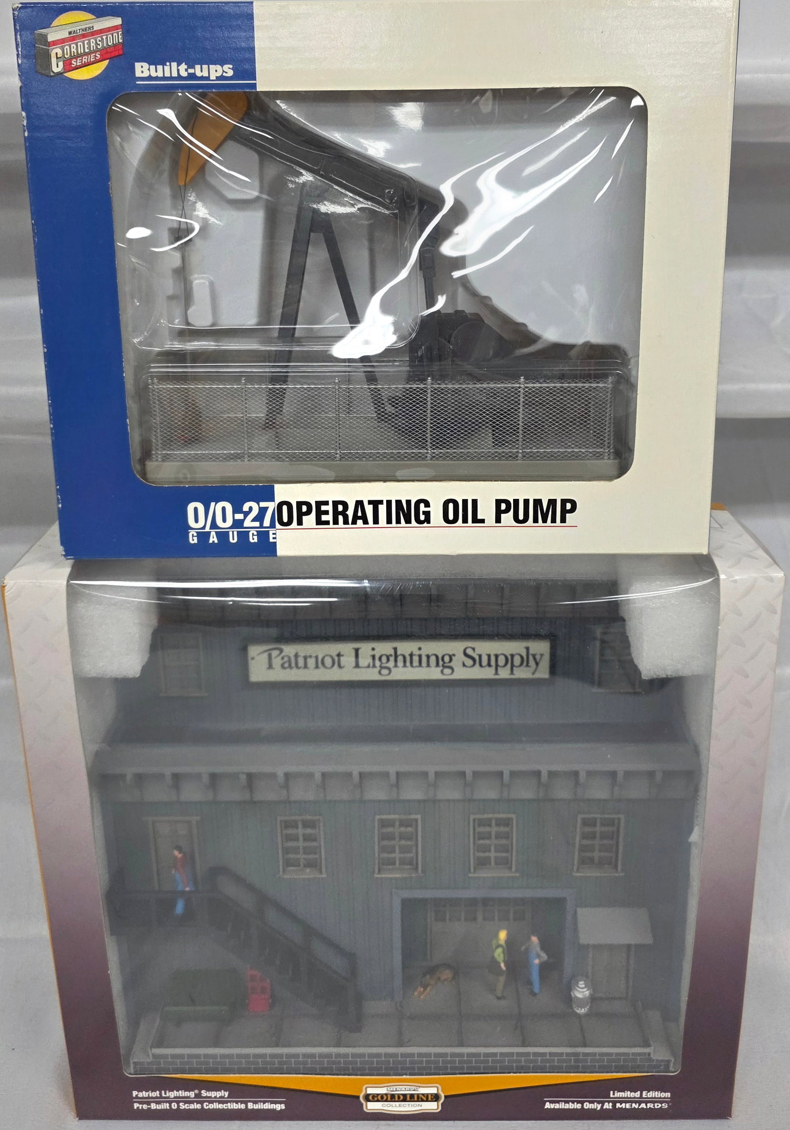 Train Layout Accesories Lot of 2 (NIB): Train Layout Accesories Lot of 2 both are new in box, C-10. Walthers 933-2705, Corner Stone Series Build ups, Oil Pump. C-10. 2. Menards' Gold Line Collectioin 279-5925, Limited Edition Patriot