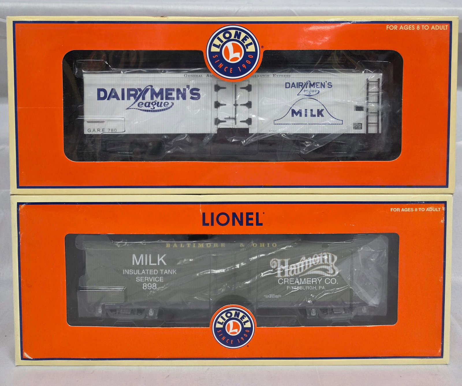 Lionel TCA 2004 Convention Milk Car Lot of 2 (NIB): Lionel TCA 2004 Convention Milk Car Lot of 2 (NIB). Both are C-10 (NIB). 1-6-52333 (Baltimore and Ohio) TCA 50th Anniversary 2004 Convention Harmony Milk Car with Lou Redman Figure. 2-6-17370 Dairyman