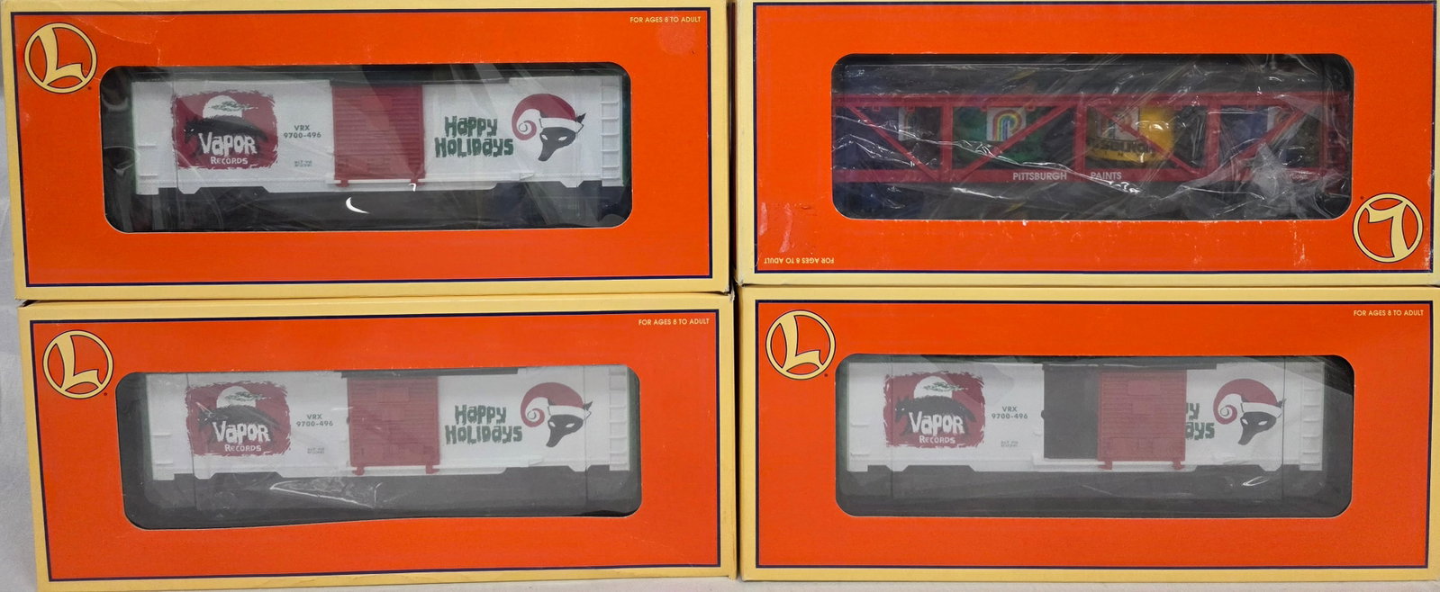 Lionel Boxcar Lot of 4 (NIB): Lionel Boxcar Lot of 4 (NIB). All C-10 condition. 1. 6-19446 Pittsburg Paint Vat Car. 2. (X3) 6-26208 Vapor Records Box Car. Boxes are all in very good condition.