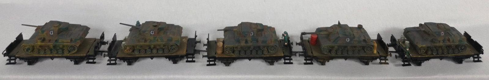Marklin HO Custom Prototype Military Flat Car Lot: Marklin HO Custom Prototype Military Flat Car Lot of 5, with Germany WWII Tank and military personal. In G+ to VG condition.