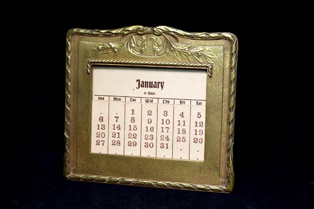 Tiffany Louis XVI Calendar: Bronze Dore Tiffany Louis XVI perpetual calendar marked Tiffany Studios, New York, 1830. 6 1/8" x 5 5/8" high. Very good condition.