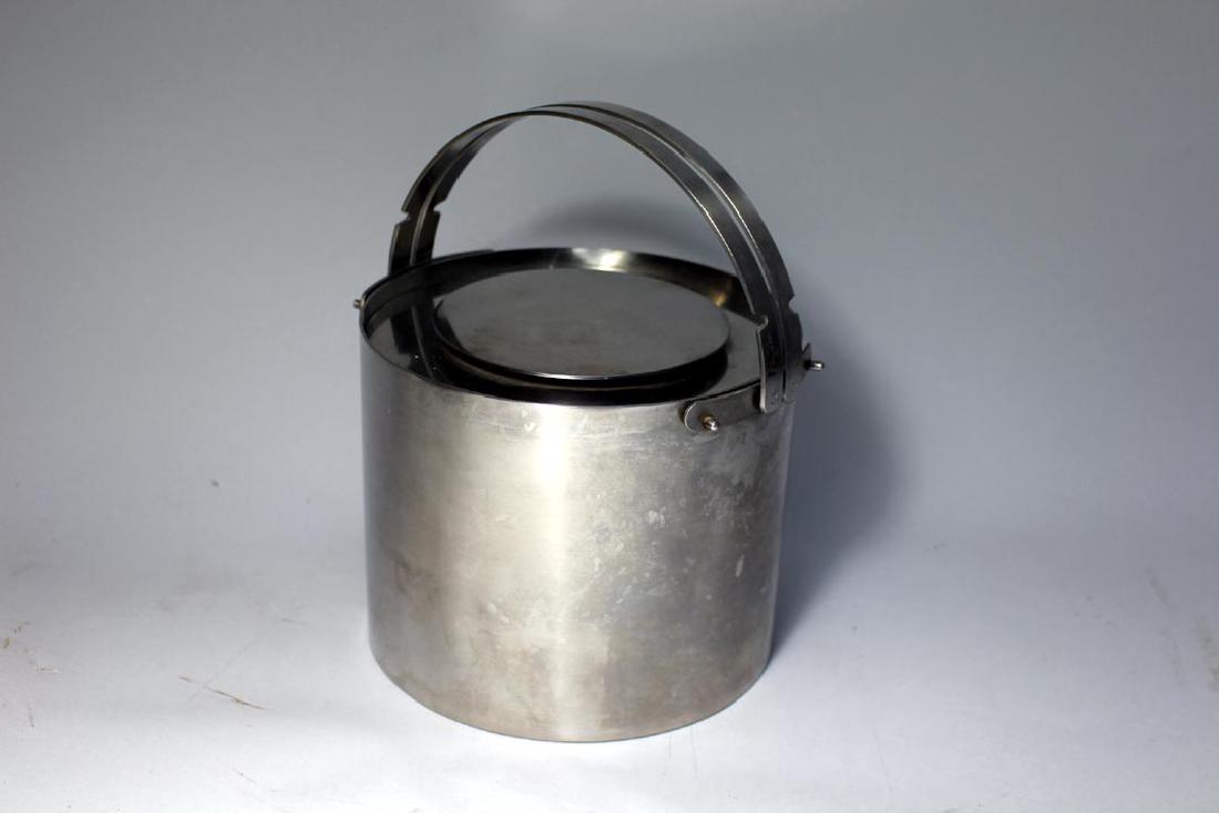 Arne Jacobsen For Stelton Danish Ice Bucket: Stainless steel ice bucket with double handles that lock down to access lid. Unmarked. 7" diameter x 5 3/4" high + handles. No dents only normal wear due to age. 1960s.