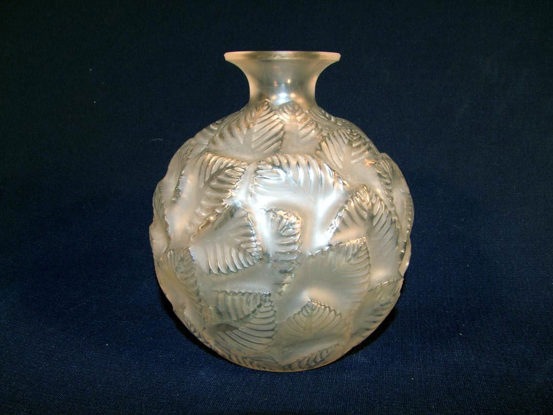 R. Lalique No. 984 Ormeaux Vase: Clear and frosted vase. Signed in script R. Lalique France. 1/4" scratch on upper inside rim, shown in photo. 6 1/2" high. Circa 1926