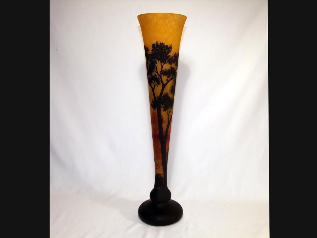 25 1/4" Daum Nancy 3-color Cameo Vase: Magnificent cameo cut floor vase with autumn colors of brown and orange trees on a mottled yellow background. Signed Daum Nancy with the Cross of Lorraine. Perfect condition.