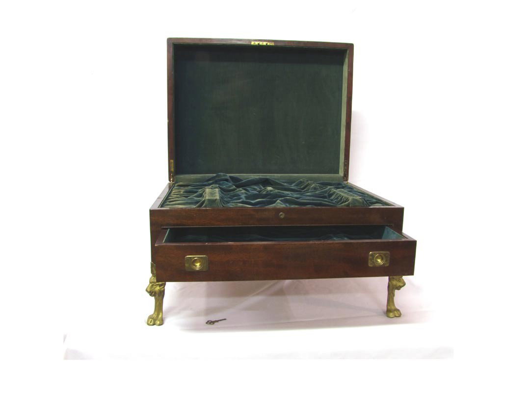 Mahogany Silverware Chest: Turn of the century key locking silverware chest with lower drawer. Brass handles on the sides, brass guards on each corner and brass plague on top with no monograms. Interior is linned and fitted to 