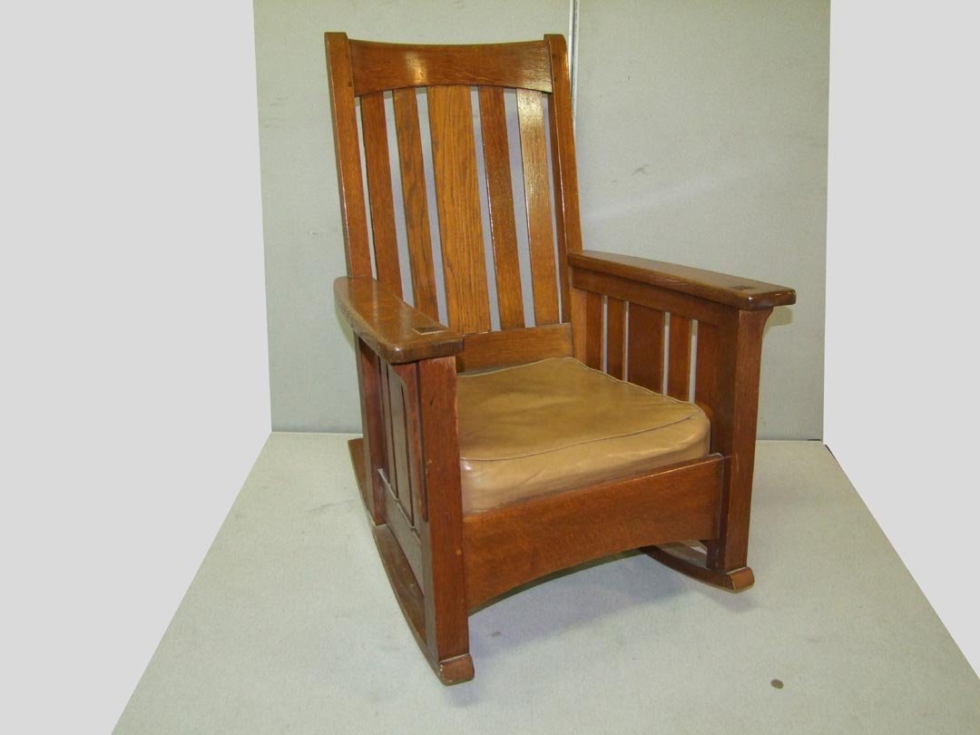 Signed #1646 Limbert Rocker: Signed under the arm with the branded mark, 29 3/4" wide at the arms. Five slat back with 4" center board flanked by two 2 1/4" vertical boards. Front arm supports are mortised through the flat top ar