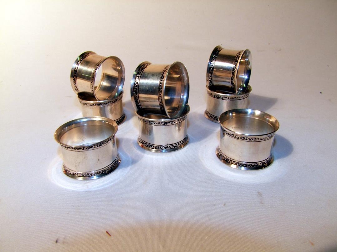 Set OF Eight Wallace Sterling Napkin rings: Marked Wallace Sterling 7413, each measuring 1 3/4" in diameter x 1 1/8" wide. 8.465 ozt. No monograms.