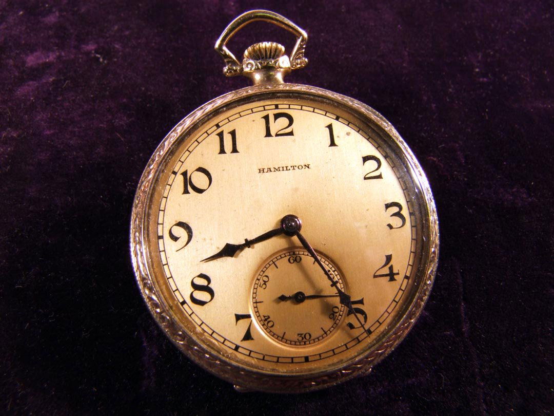 Hamilton 23 Jewel Pocket Watch: Hamilton 920, 12S open face Pocket Watch: serial no.1920993. Gold filled case marked Hamilton, quality, Permanent, 419187. Monogram on back. 1 3/4" wide, works.