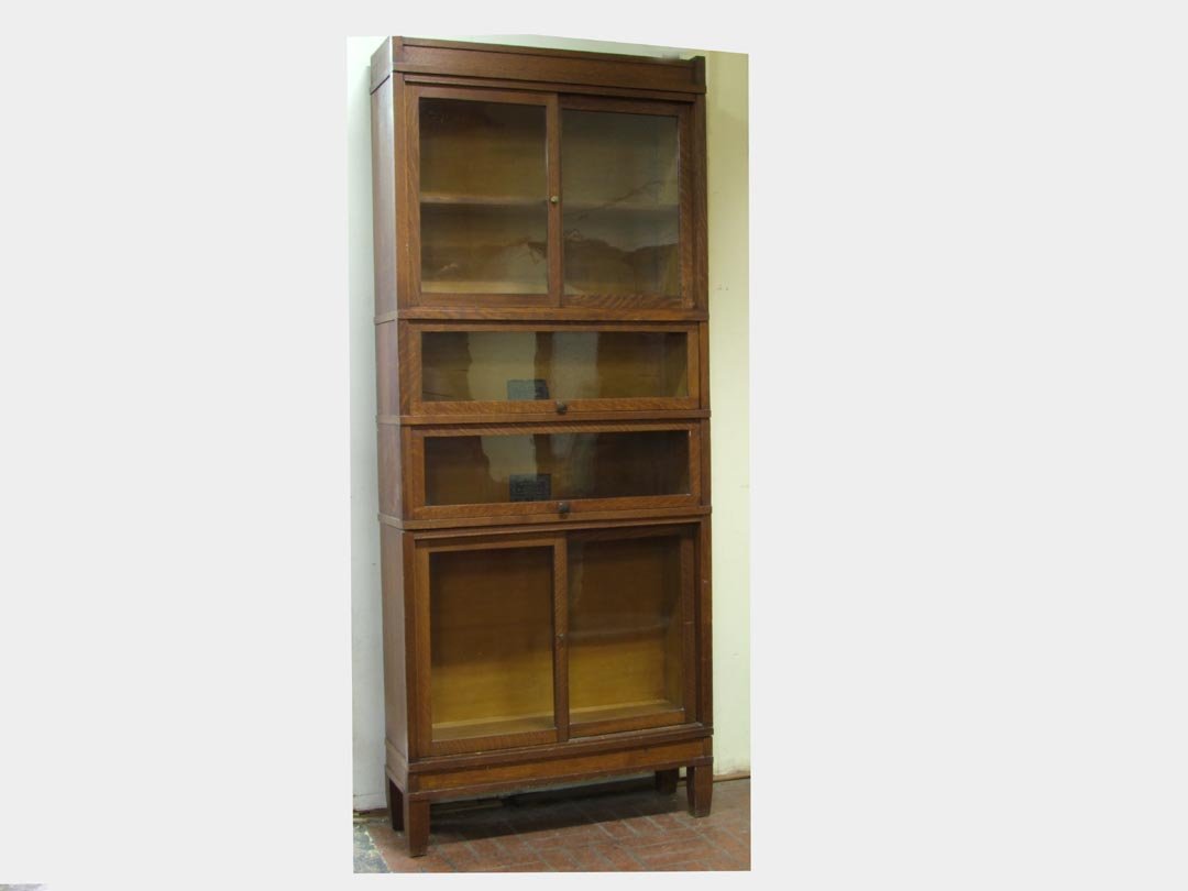 Art-Mission Sectional Bookcase: Quarter sawn oak bookcase with sliding glass doors on the top and bottom sections and two traditional stacking sections in the middle. Art-Mission by The Globe-Wernicke Co., Cincinnati, Ohio. 34 3/4"