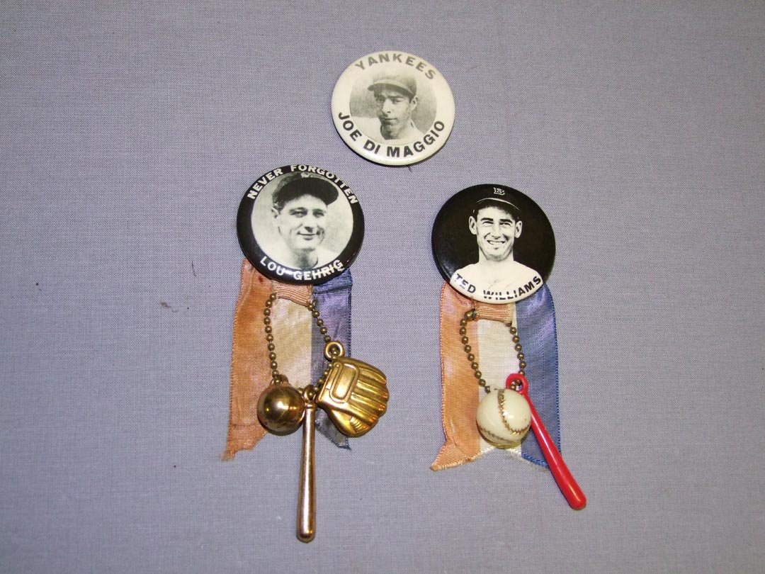Three Baseball Pin Back Buttons: Joe Di Maggio and Lou Gehrig for New York Yankees. Ted Williams for Boston Red Sox. Di Maggio has light rust and oxidation on back, Gehrig has oxidation on back and Williams is stating to show oxidati