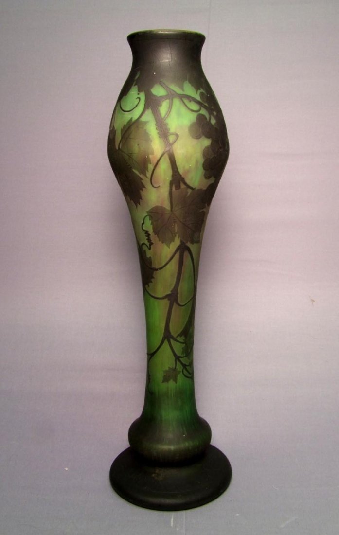 Green Daum Nancy Cameo Vase: Grapevine design with grape clusters, intertwining vines and leaves. Signed in cameo Daum Nancy with the Cross of Lorraine. 16" high.