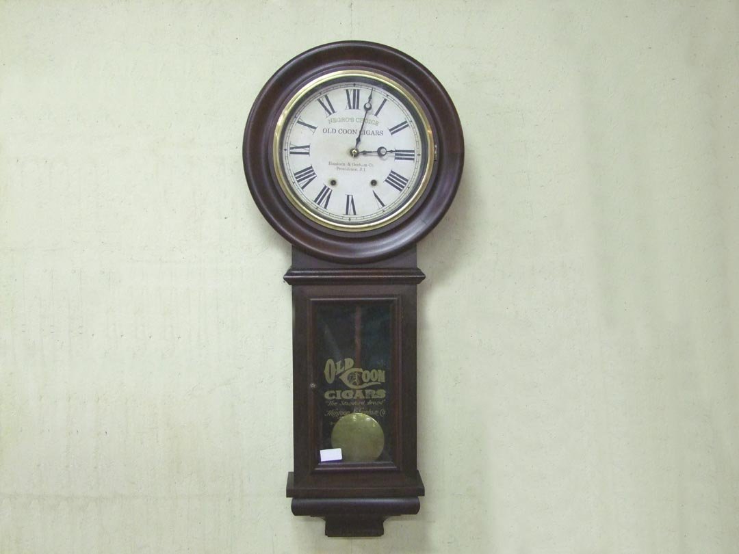 New Haven Clock With "OLD COON CIGAR" Advertising: Refinished Mahogany 8-day New Haven wall clock with advertising: "Negro's Choice, Old Coon Cigars, Huntoon & Gorham Co., Providence, R.I.". Works. 18" x 41" high.
