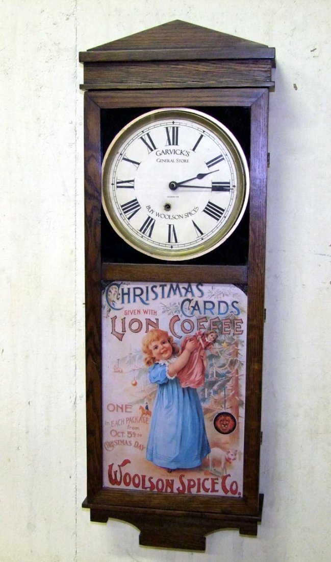 Garvick's General Store Advertising Clock: Refinished Ingraham & Co. clock with advertising on the face: "Garvick's, General Store, Pittsburg, Kan., Buy Woolson Spices". The lower door has tin insert with little girl at Christmas time advertis