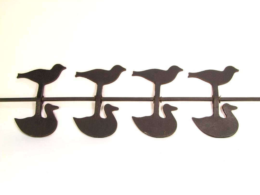 Carnival Targets: Set of four double targets each with a duck and a swallow measuring 8 1/2" high. Made of iron and held in place on the 43 1/2" iron rod by cotter pins that allow them to rotate freely on the rod. The 