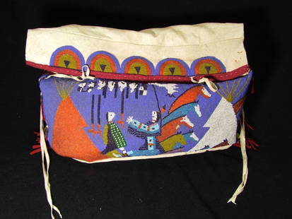 Native American Beaded Saddle Bag: An example of this bag is on display in the National Museum of the American Indian in Washington DC. with multi-colored pictorial beadwork on the front and sides. Six sets of twin tin cones decorate e