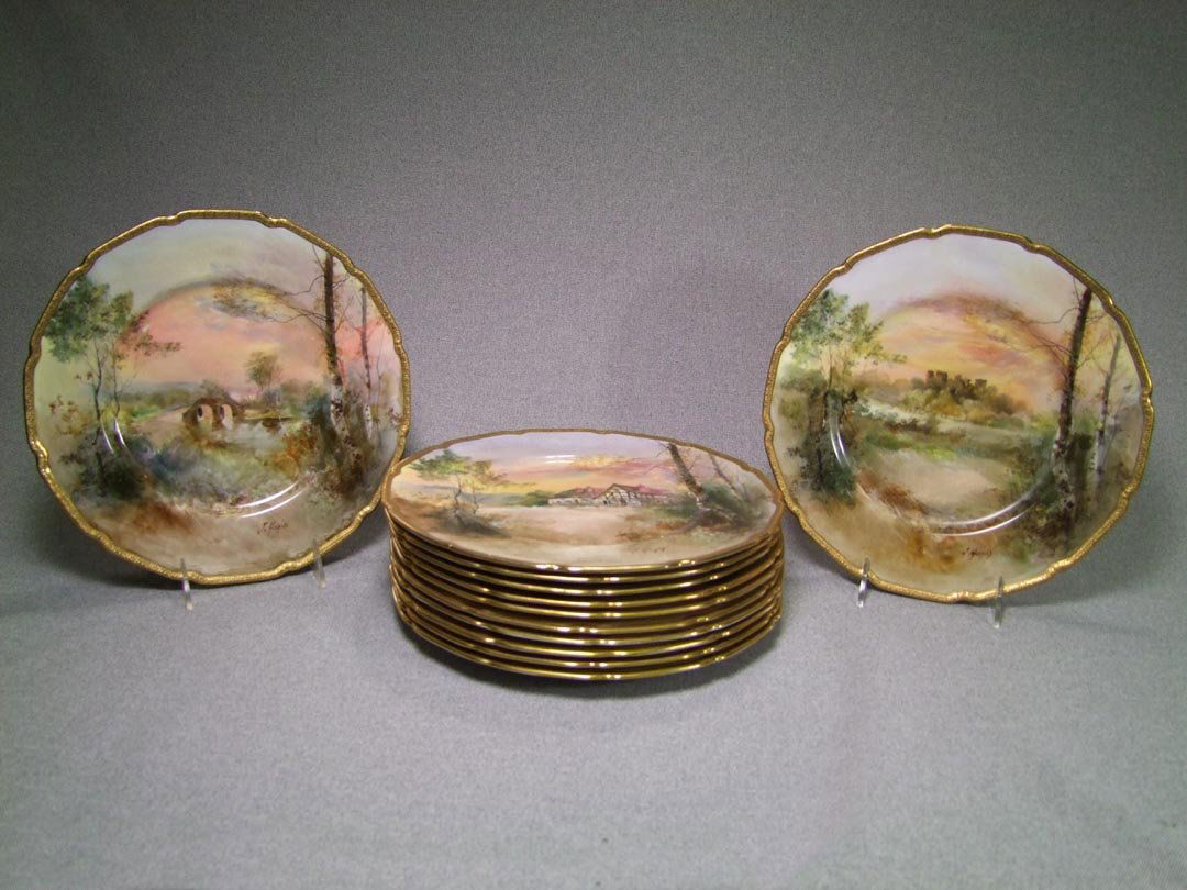 12 Hand Painted Royal Doulton Plates: All painted by the same artist J. Hughs with different landscapes. Titles on the back: Dunolly Castle, Ross Castle, Alberfoyle, Ludlow Castle and Shakespeare's Country series: Aston Cantlow, Guys Clif