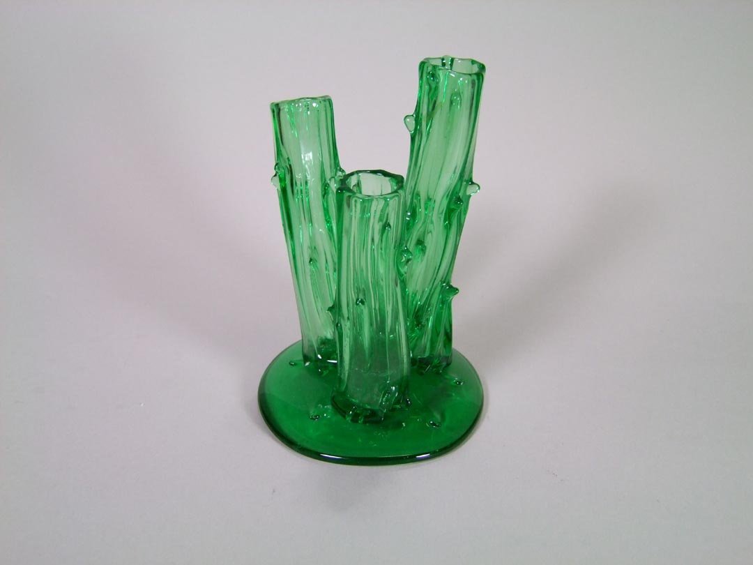 Steuben Tree Trunk Vase: Pomona green vase with three trunks on a 4" diameter base. 6" high. No chips, cracks nor repairs. Unsigned.