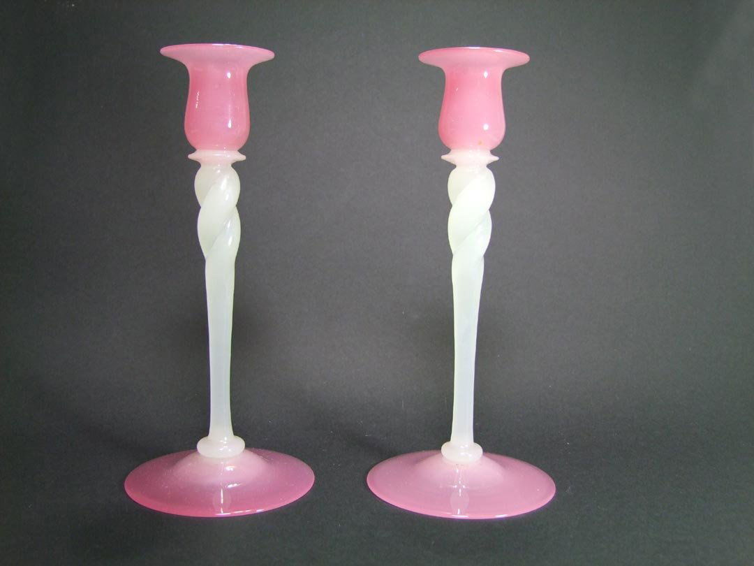 Rosaline And Alabaster Candlesticks: Pair of Steuben 10" candlesticks with rosaline tops and bases with alabaster twisted stems. 4 1/2" diameter base x 10" high. No chips, cracks nor repairs. Unsigned.