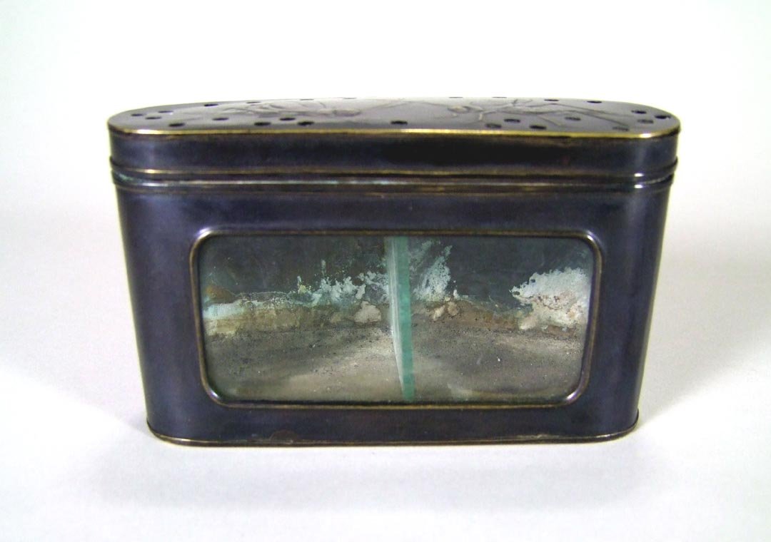 Copper Cricket Cage: Early 20th century Chinese brass box with sight window in the front and glass divider in the cage used to determine the aggressiveness between two crickets. Air holes and embossed crickets on the lid 
