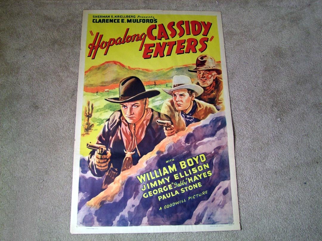 Hopalong Cassidy Poster: Sherman S. Krellberg Presents Clarence E. Mulford's "Hopalong CASSIDY ENTERS". Poster shows William Boyd, Jimmy Ellison and Gabby Hayes printed by Morgan Litho Corp. #26529. White tape on the back sho