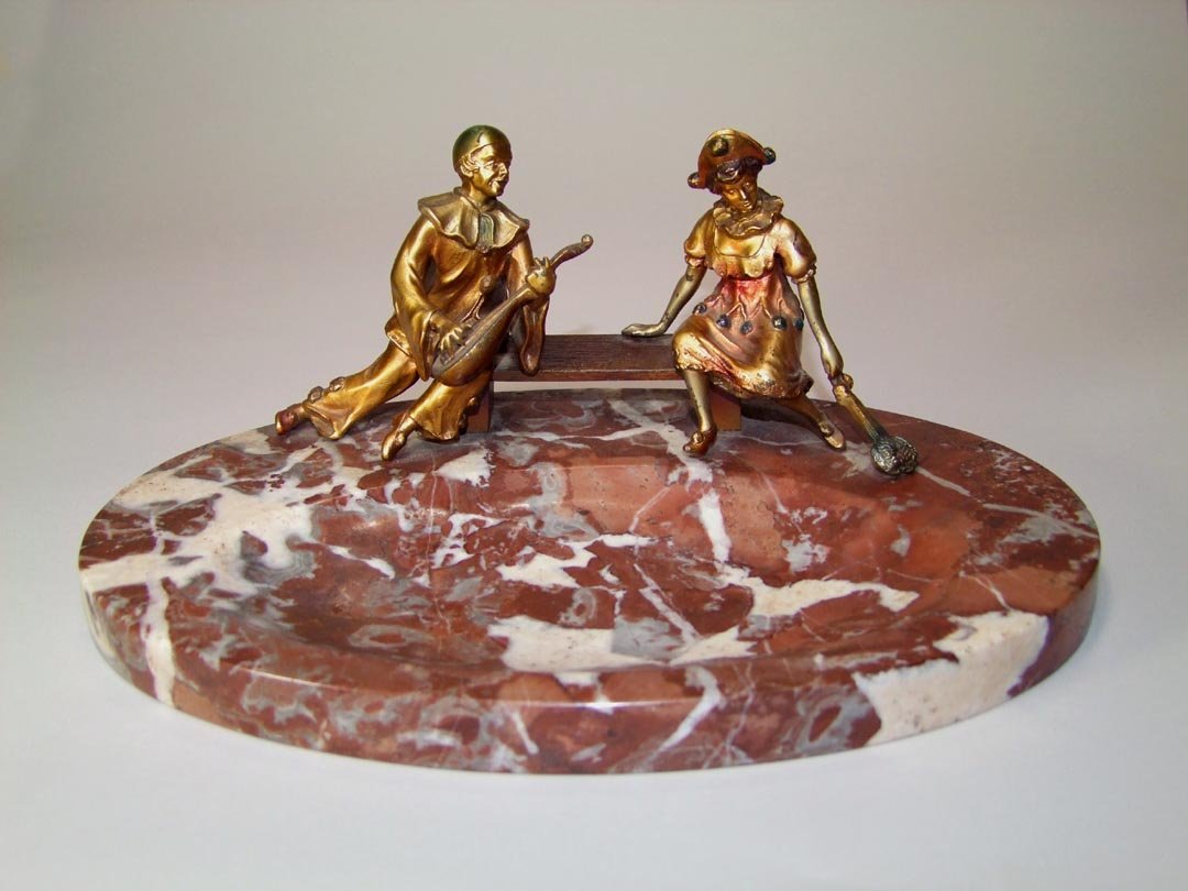 Vienna Bronze Minstrel: Oval marble tray with seated polychrome minstrel playing his mandolin for the young lady sitting on the opposite end of the bench. 11 1/2" x 7 1/2" x 4 1/2" high. No Makers Mark found.