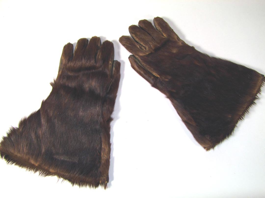 Bear Hide Gloves: Lined gloves made of bear hide. 4" section of stitching has come out of one but the leather is pliable and can be restitched. Men's size medium.