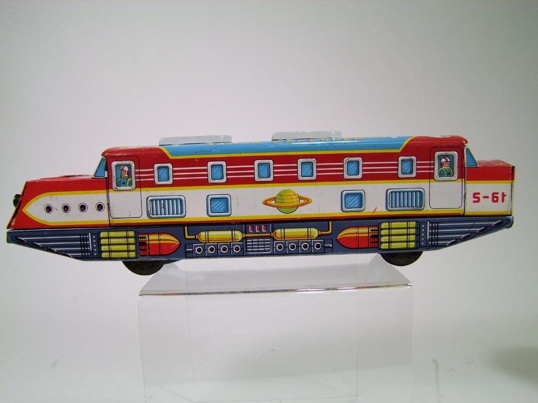 Nomura Space Explorer: Toy Nomura Trade Mark friction space toy. Minor surface abrasions and antenna missing. 13" x 2 1/4" x 3 1/2" high.