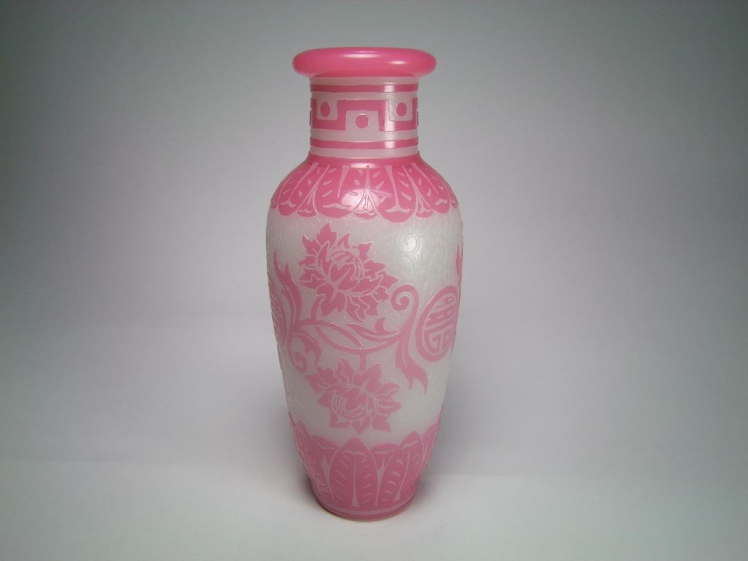 Steuben Acid Cut Back Vase: Chinese Peking design with pink cut back to alabaster with pink flowers and medallions. Drilled for a lamp. 4" diameter x 10" high. No cracks, chips nor repairs.