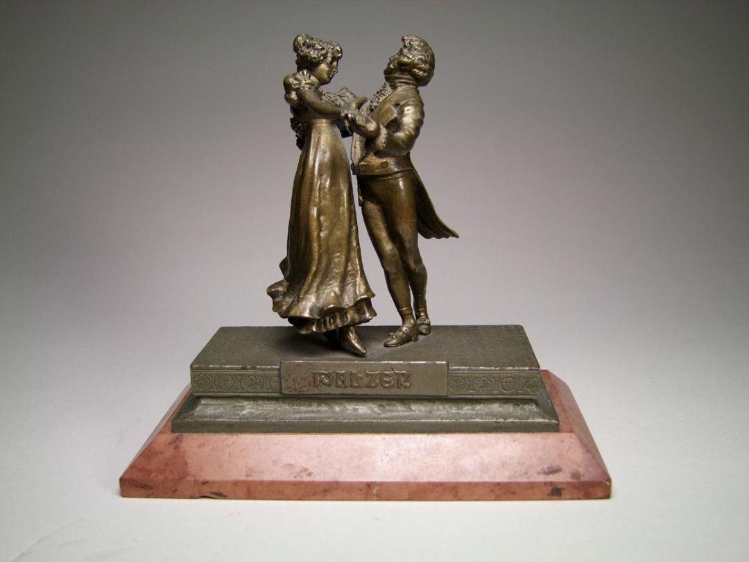 C. Kauba "Walzer" Bronze: Small bronze of a dancing couple with beautiful detail titled "WALZER" by Carl Kauba, Austrian 1865 - 1922. Signed on the back and the Geschutzt mark 5433. Mounted on marble base, 5 3/8" x 2 7/8" x 5 