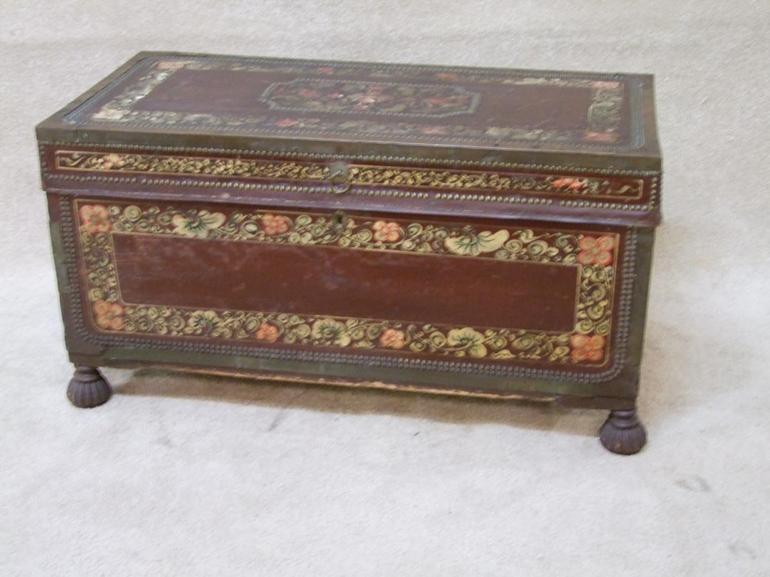 Tasmanian Dowry Chest: Leather wrapped and decorated camphor chest with brass tacks and trim. Painted with simple flowers and outlined with tacks. Missing some of brass trim otherwise very good condition. Key locking but no