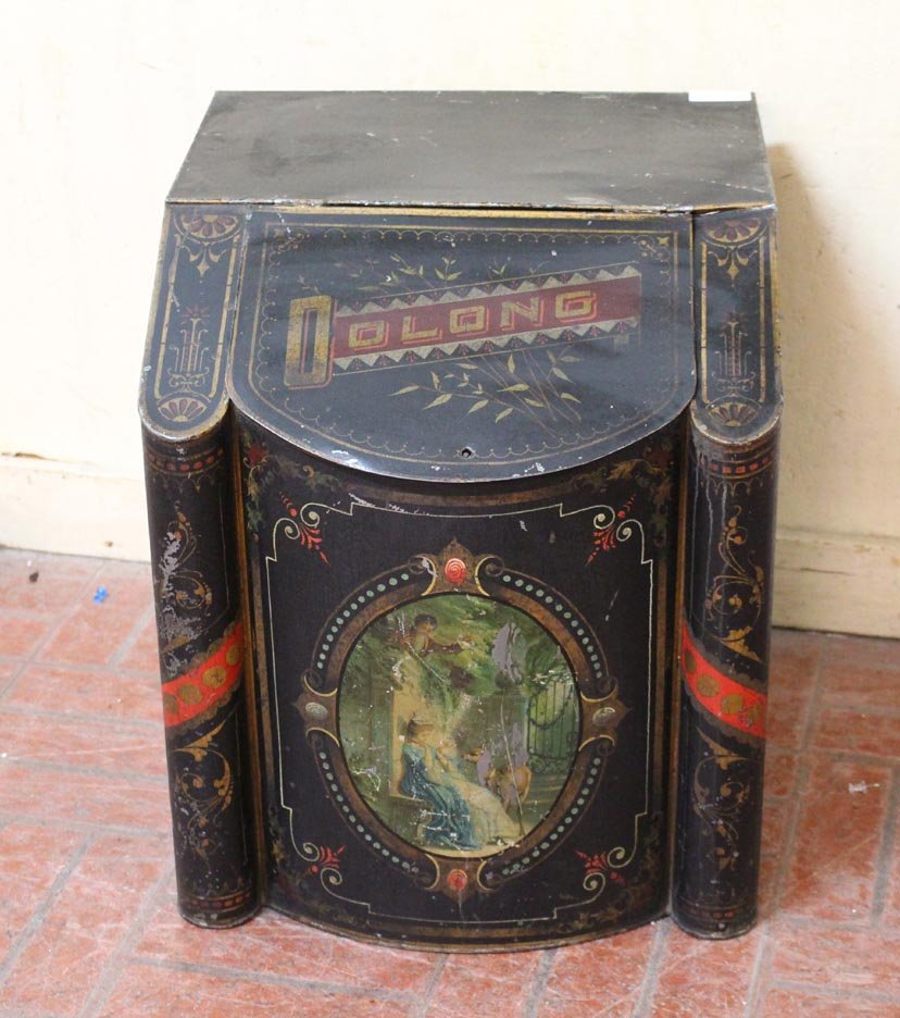 Olong Tea Box: Victorian general store decorated tin tea box. Graphics are worn and scratches. 17" x 17" x 20" high.