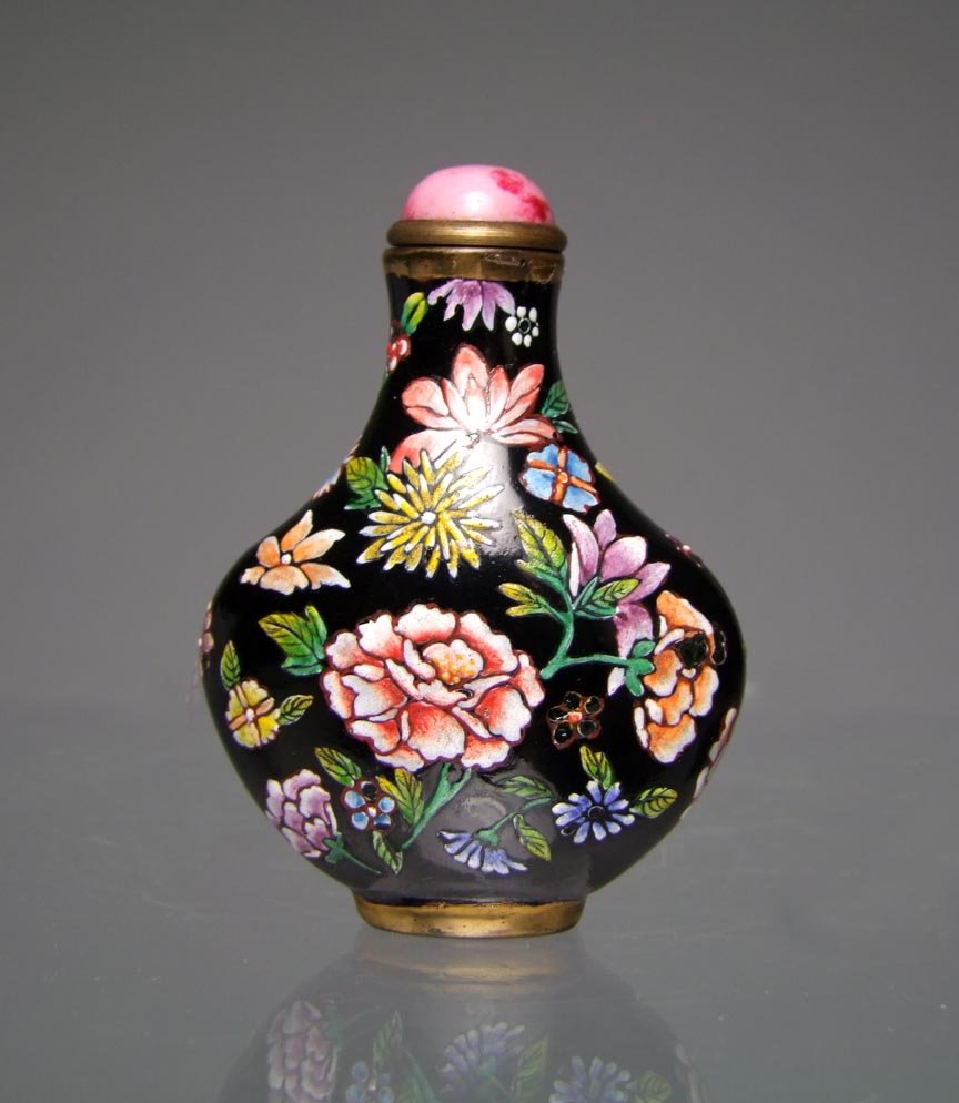 Chinese Enameled Snuff Bottle: Enamel painted on black Peking Glass with flowers, leaves and stems. Mark on the bottom is for Yongzheng production. Hardstone cap with brass scoop. 2" x 1" x 2 3/4" high. Good enameling, no chips, cr