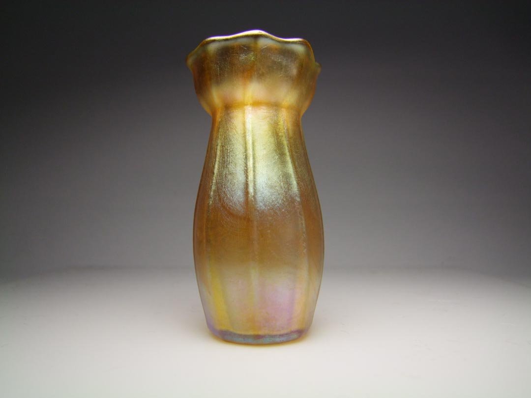 Gold Tiffany Cabinet Vase: Gold iridescent vase with ribbed body and scalloped top signed L.C.T. W6578 in very good condition 3 5/8" high.